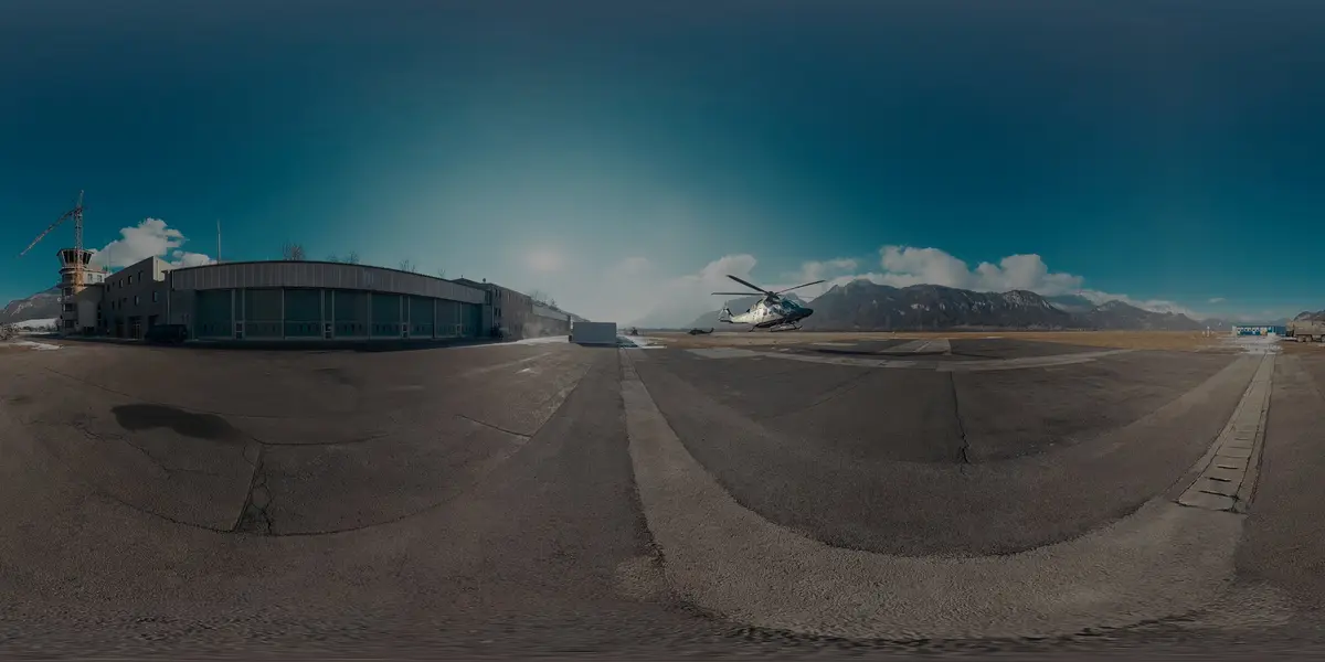 Mission Vorwärts — AW169 Helikopter beim Abheben vor dem Hangar